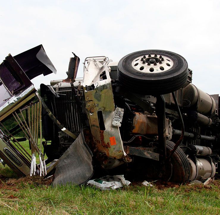 wrecked 18 wheeler on its side