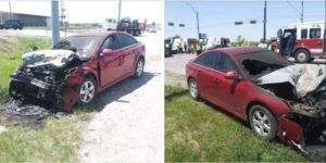A red car on the side of the road after catching fire in Dallas