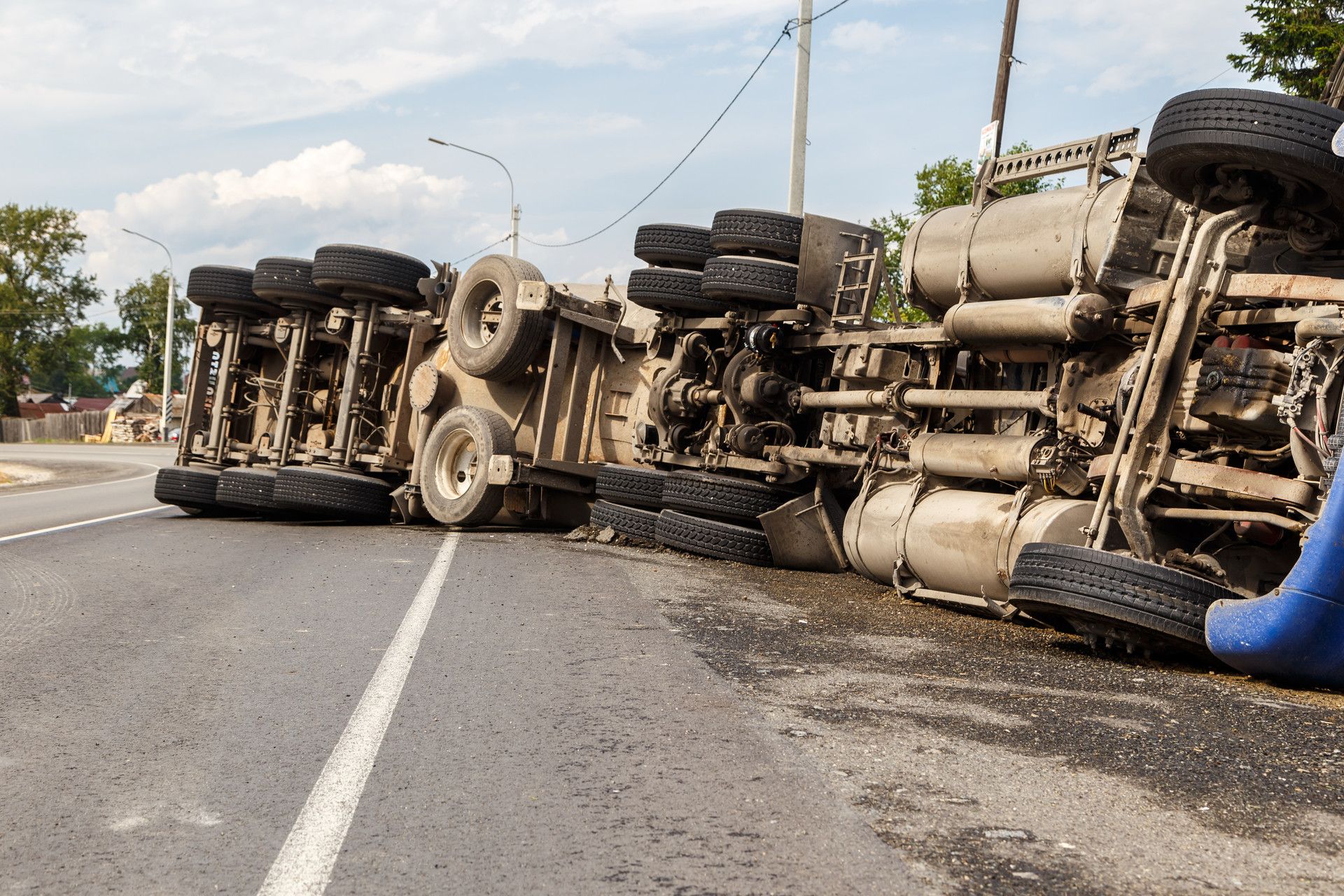 An overturned truck involve in a semi truck accident.
