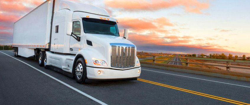 How to Safely Travel With Semi-Trucks on the Road