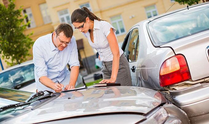 man-and-woman-exchanging-information-after-car-accident