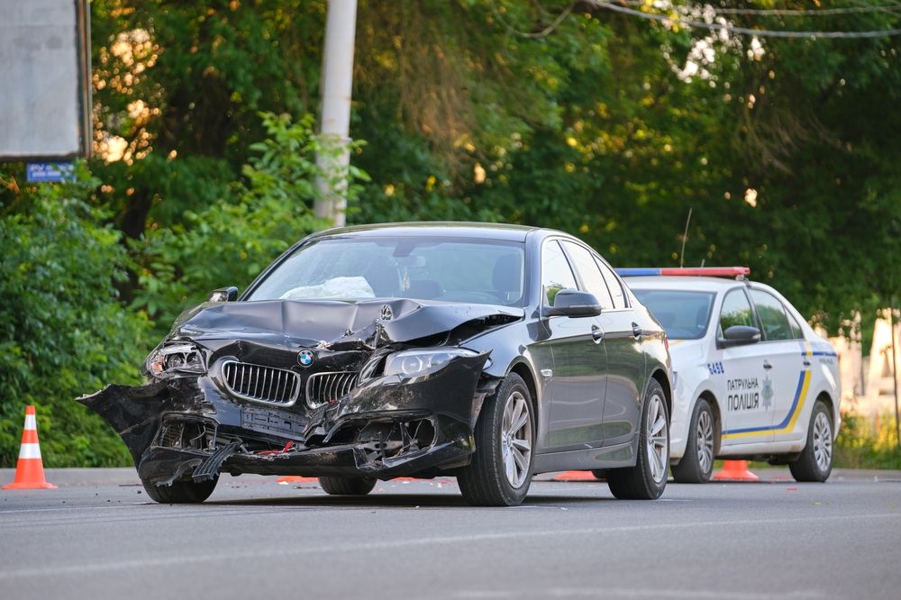 Police-Officer-Assists-Damaged-Vehicle-Car-Accident