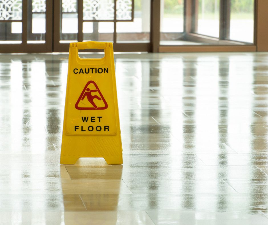 wet floor sign on slippery floor