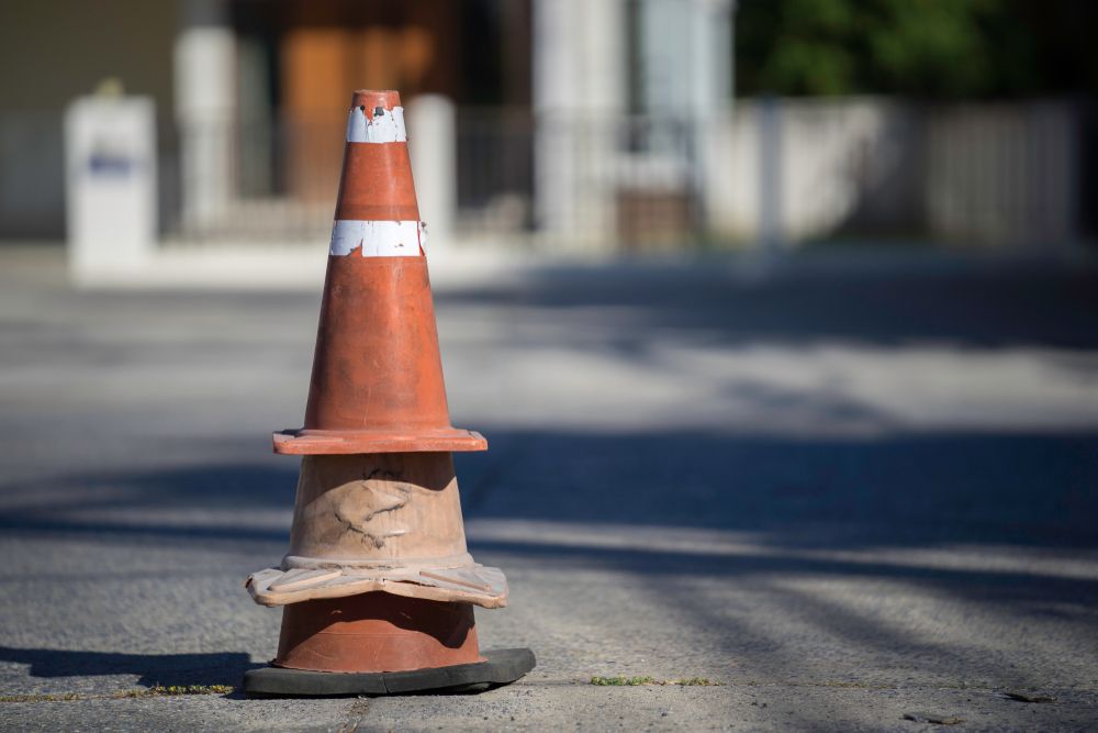 Cones prepared for placement during a highway shutdown after a car accident