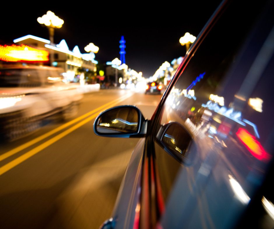 car driving fast at night