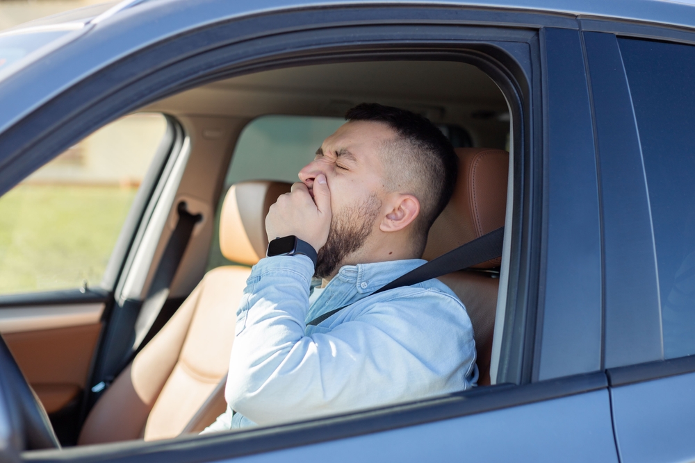 Person falling asleep at the wheel